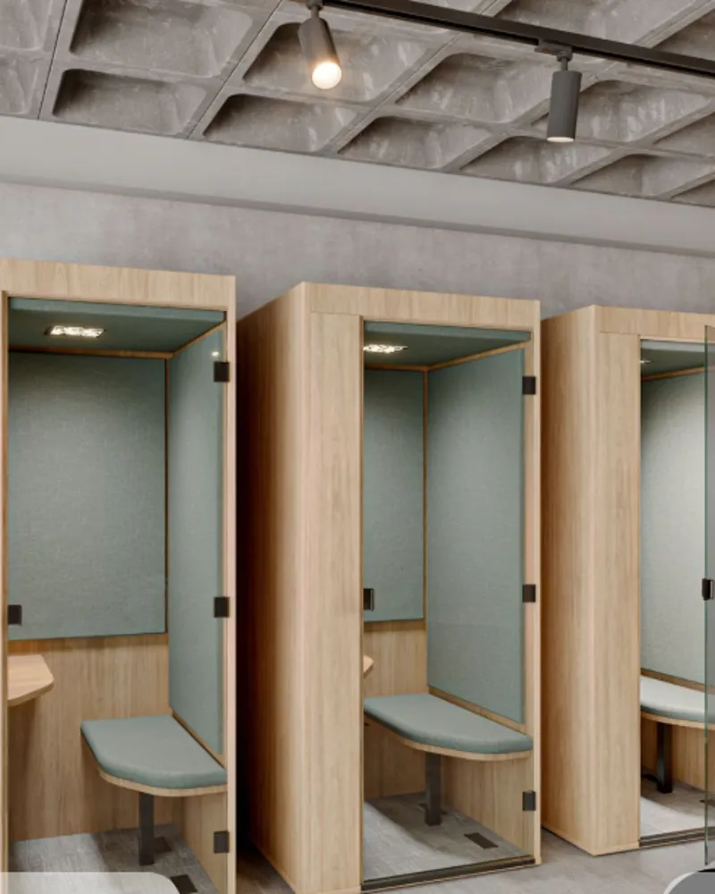 Row of timber and glass focus booths with acoustic upholstery and integrated seating